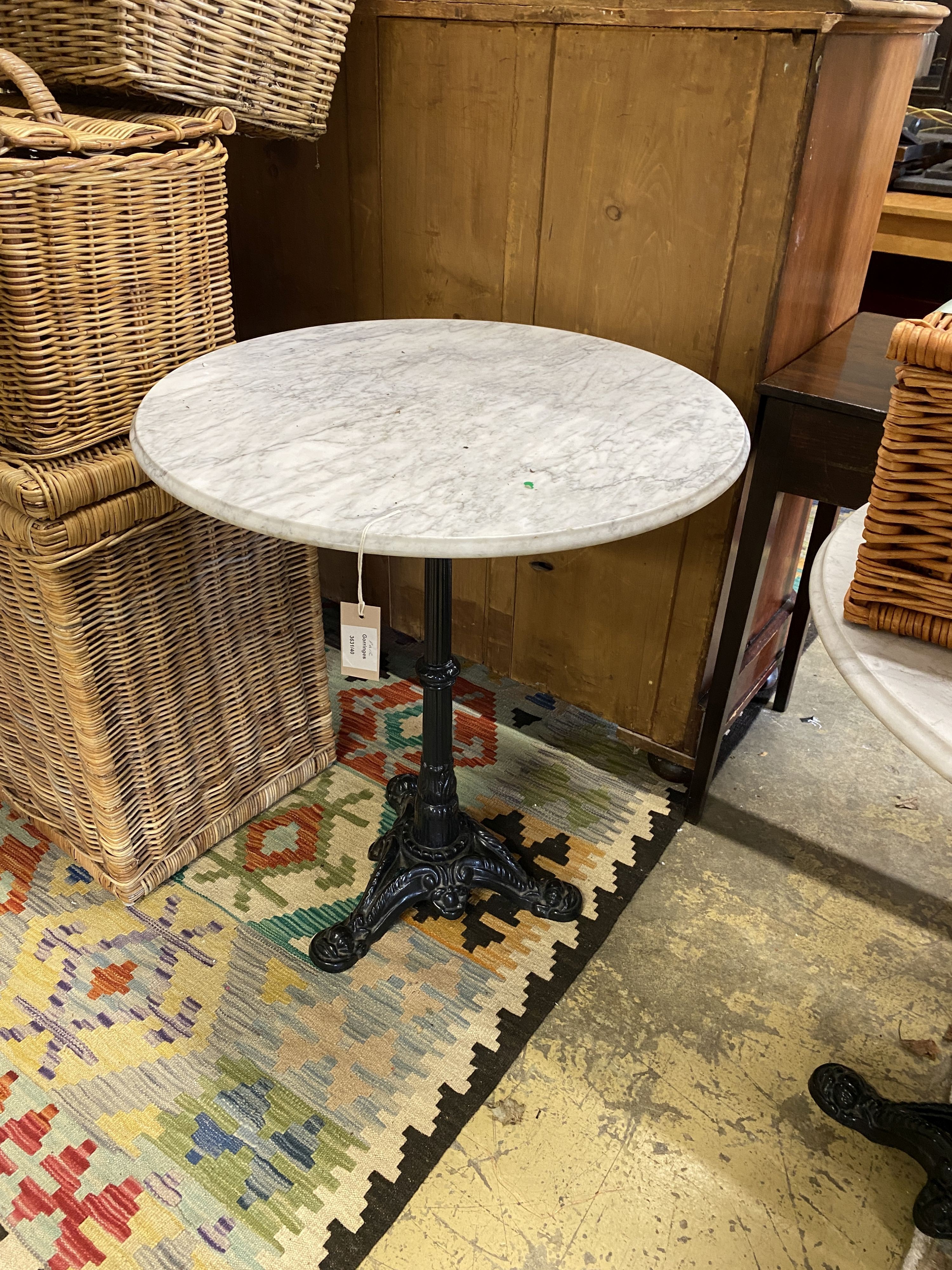 A pair of Victorian style cast iron circular marble topped pub tables, diameter 64cm, height 72cm